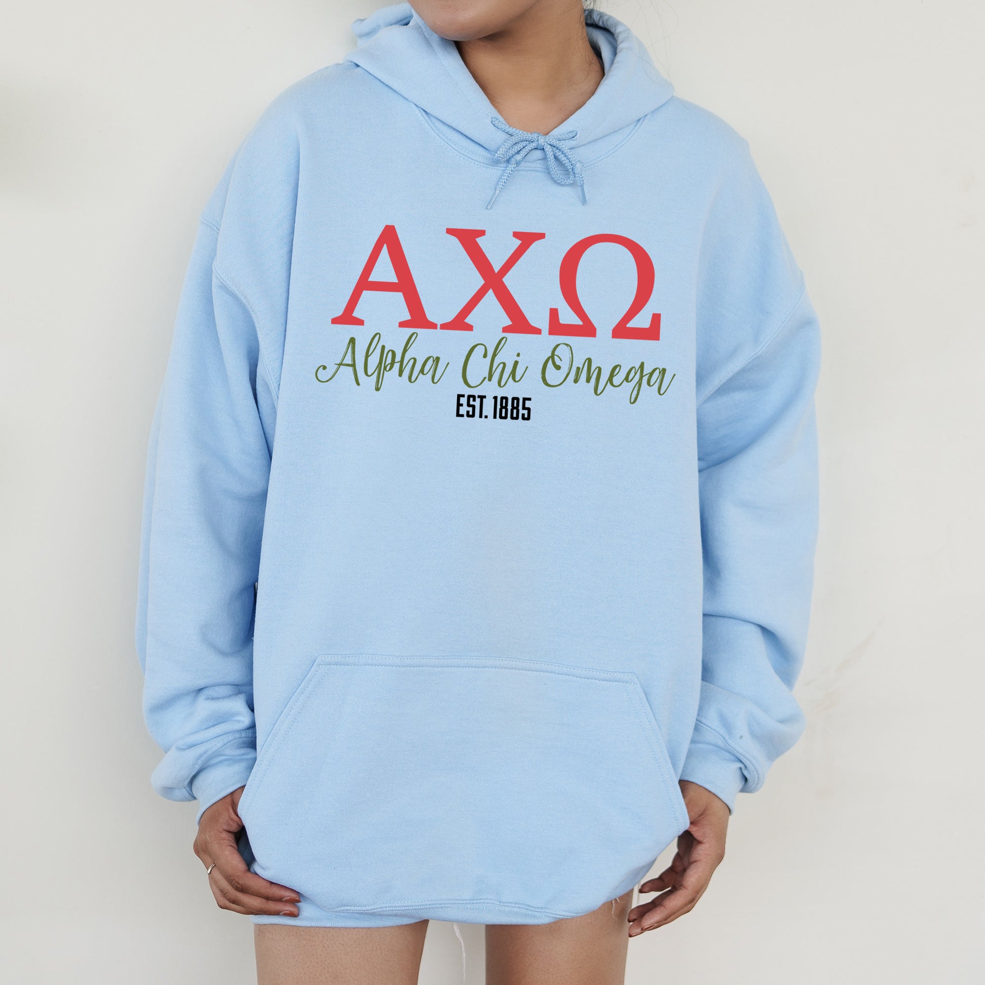 a person wearing a blue hoodie with the word axq on it