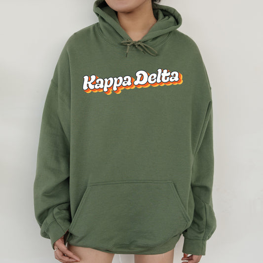 a person wearing a green hoodie with the words happy delta on it