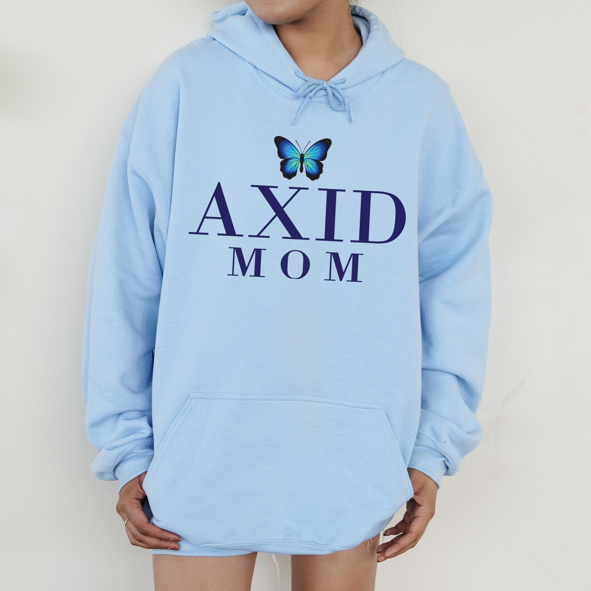 a woman wearing a blue hoodie with a butterfly on it