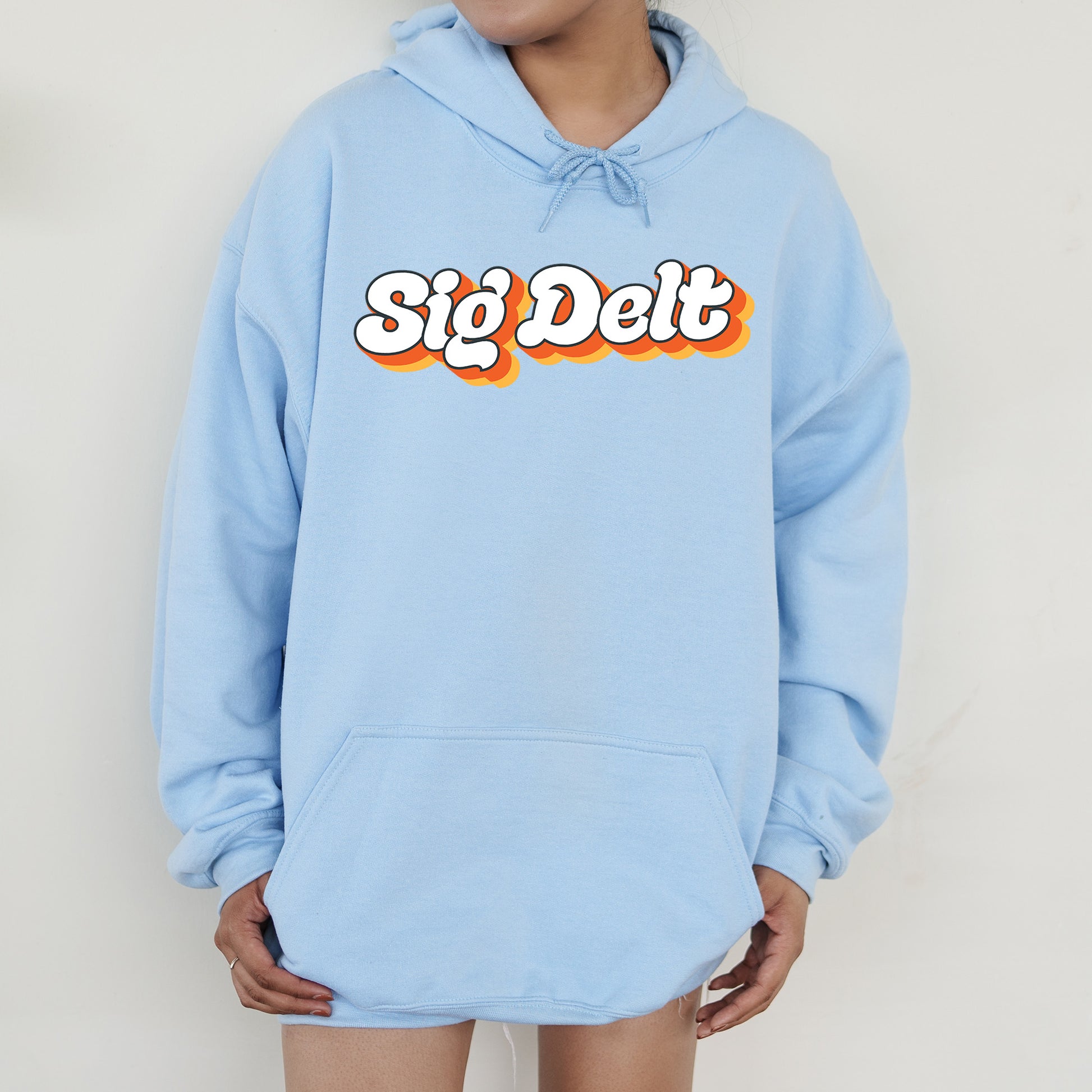 a person wearing a blue hoodie with the word sig diet printed on it