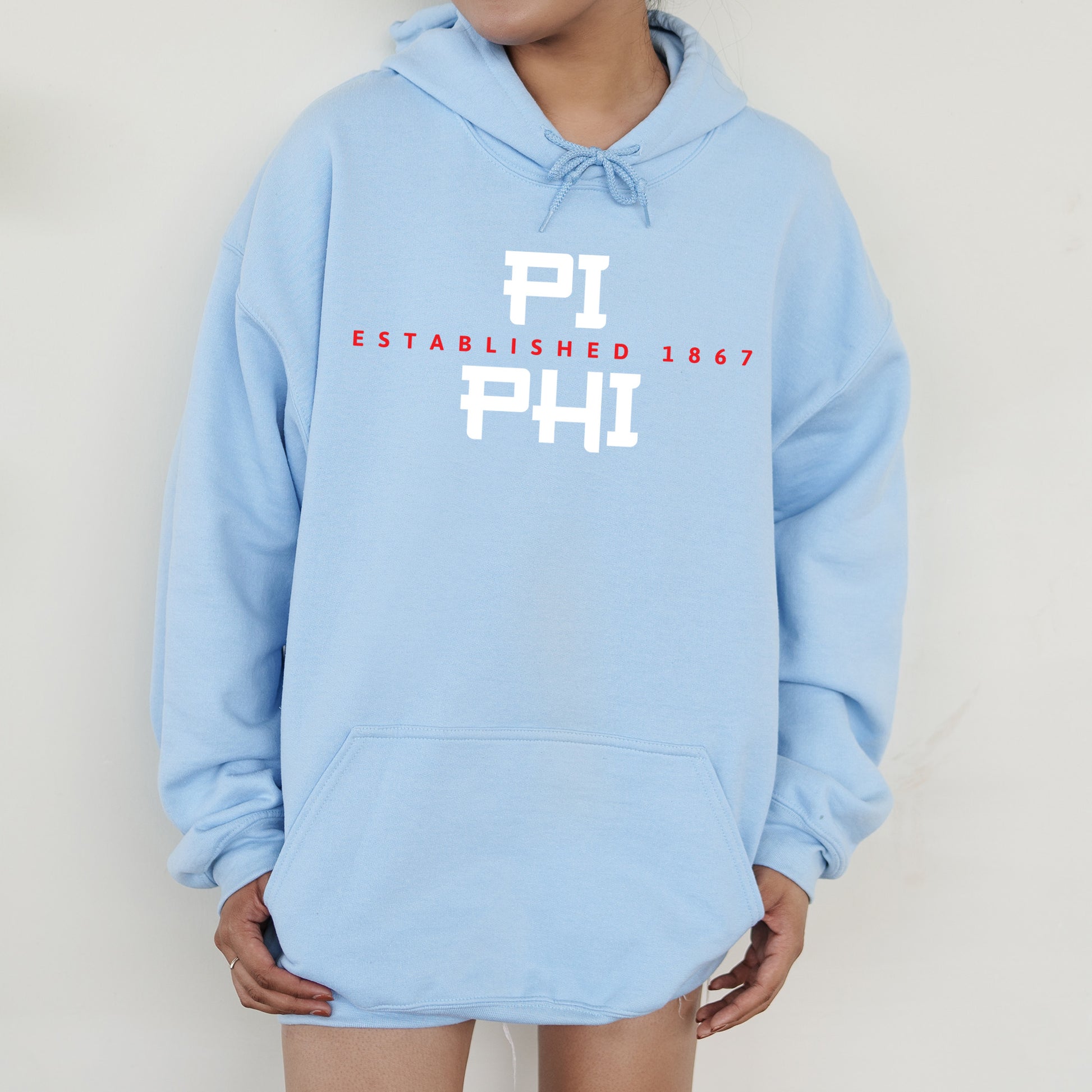 a person wearing a blue hoodie with the words phi printed on it