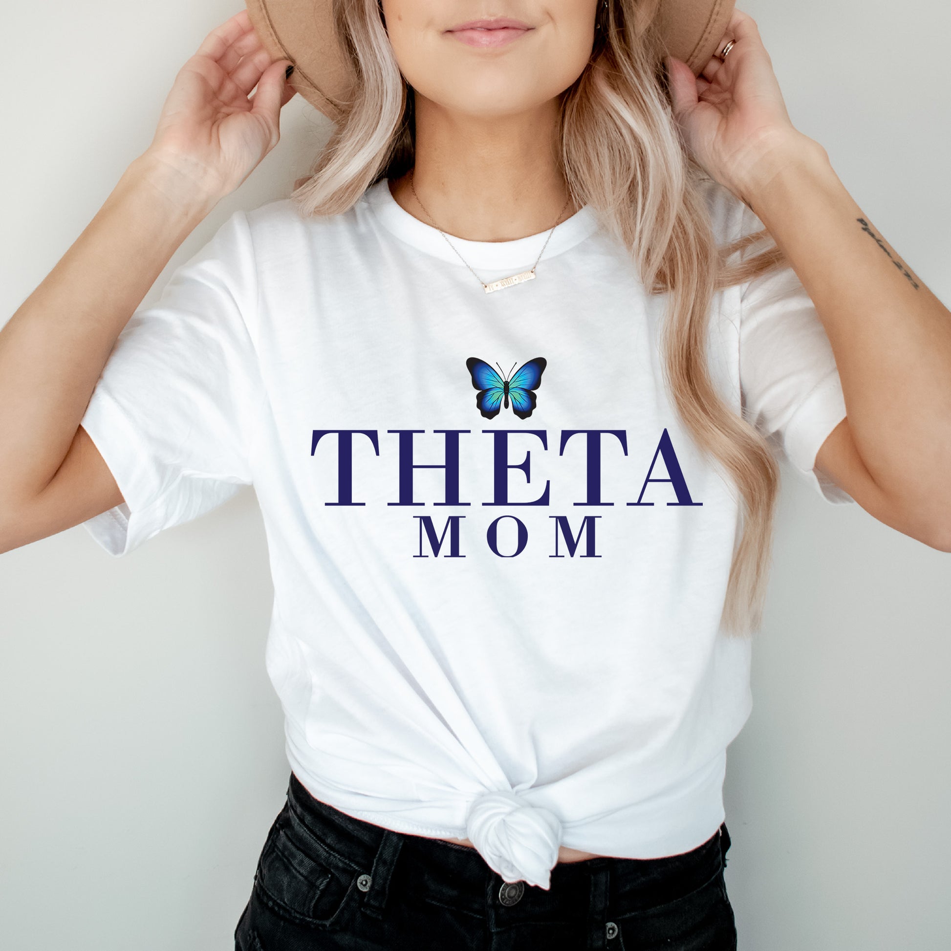 a woman wearing a hat and a t - shirt