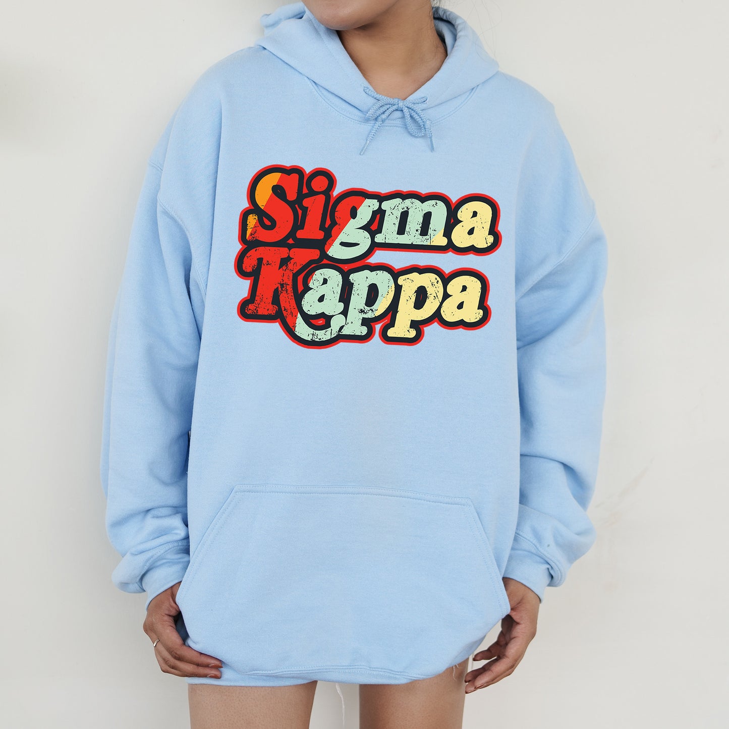 a person wearing a blue hoodie with the words stigmata rappa on it