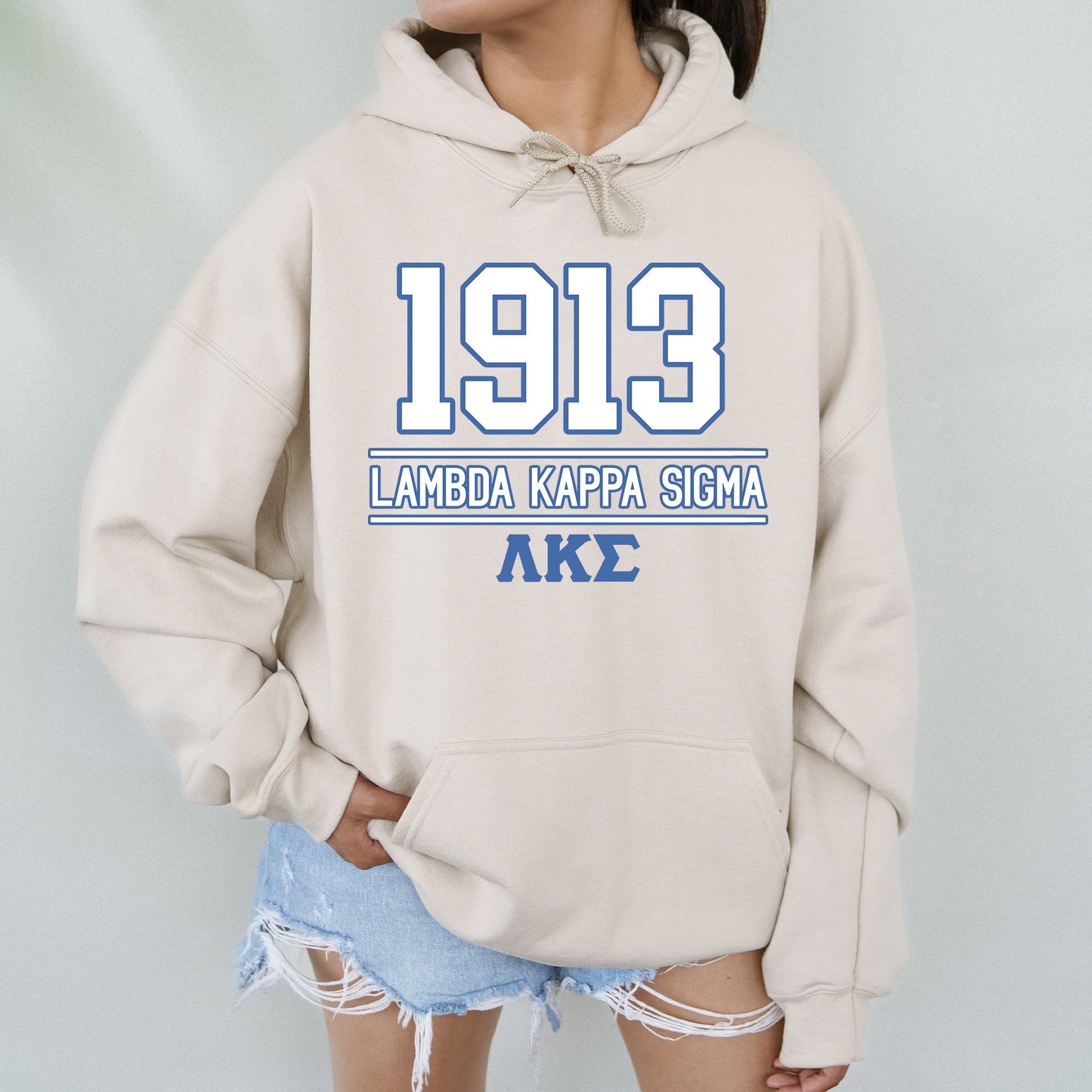 a woman wearing a hoodie with the number 919 on it