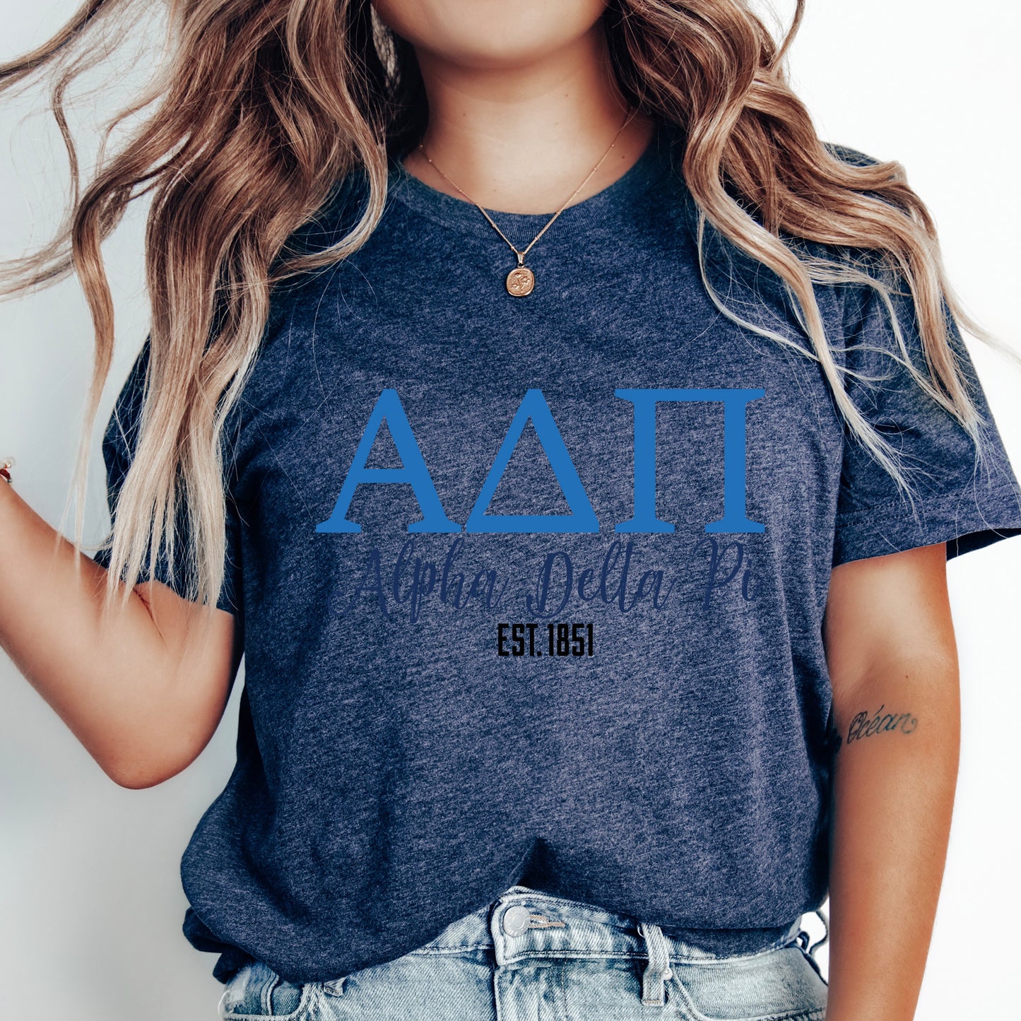 a woman with long hair wearing a blue shirt