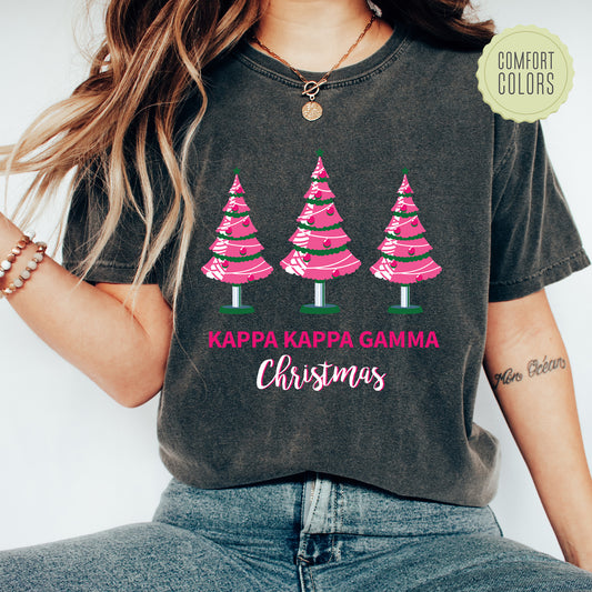 a woman wearing a t - shirt that says kapa kapa gama christmas