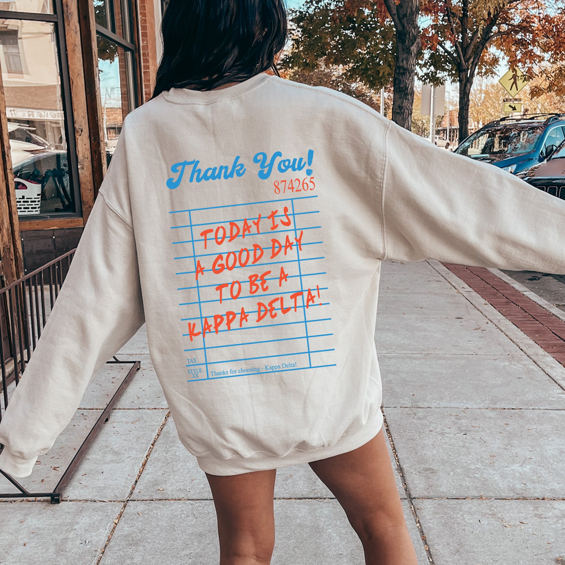 the back of a woman's shirt that says thank you