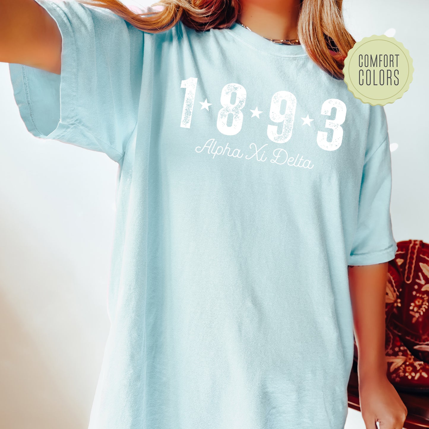 a woman wearing a light blue shirt with the number 1033 printed on it