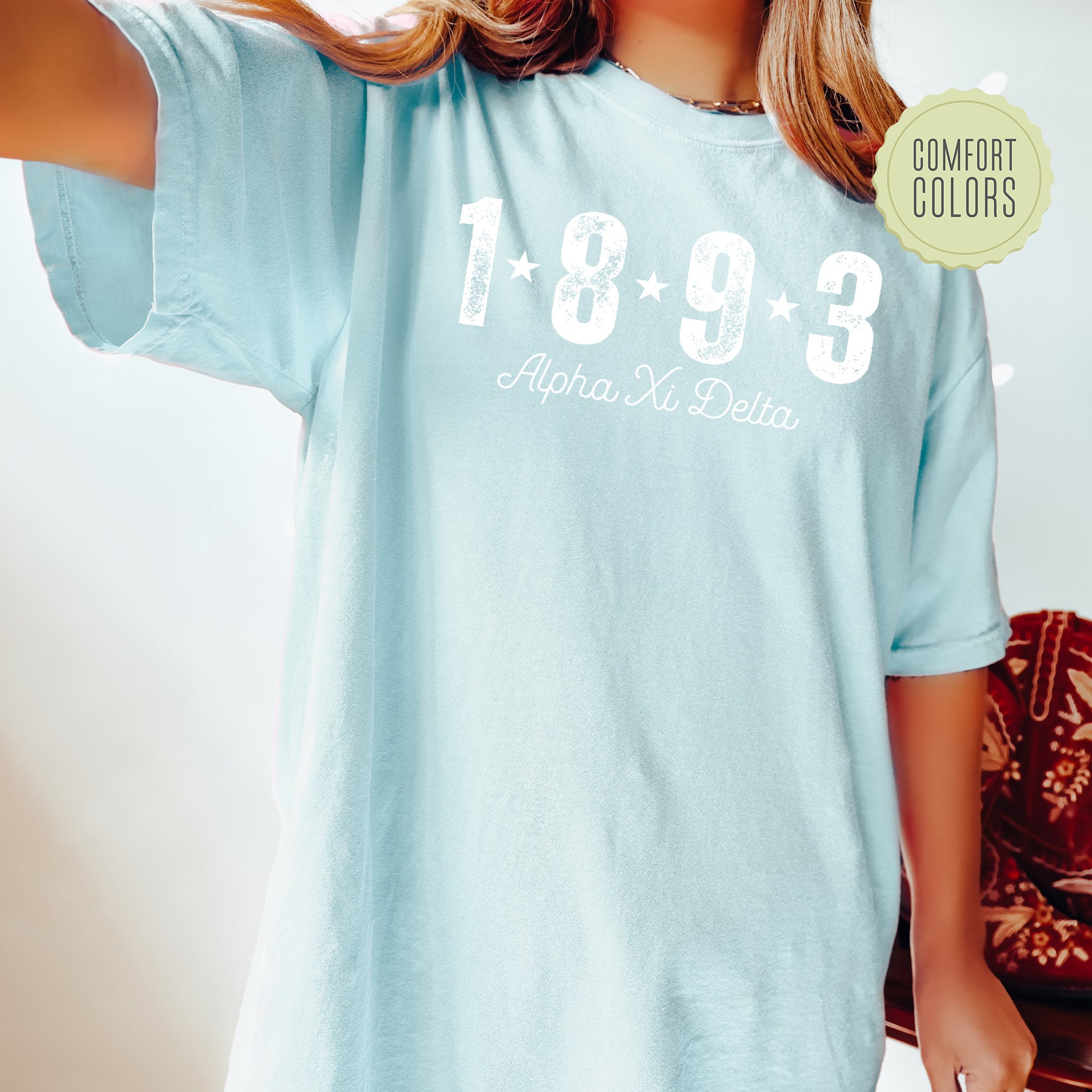 a woman wearing a light blue shirt with the number 1033 printed on it