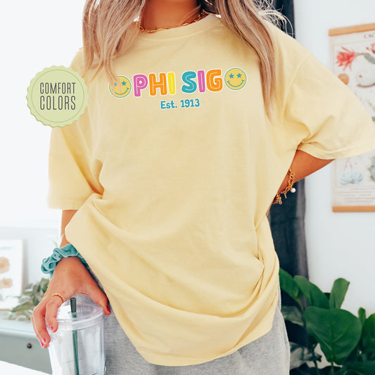 a woman in a yellow shirt holding a blender