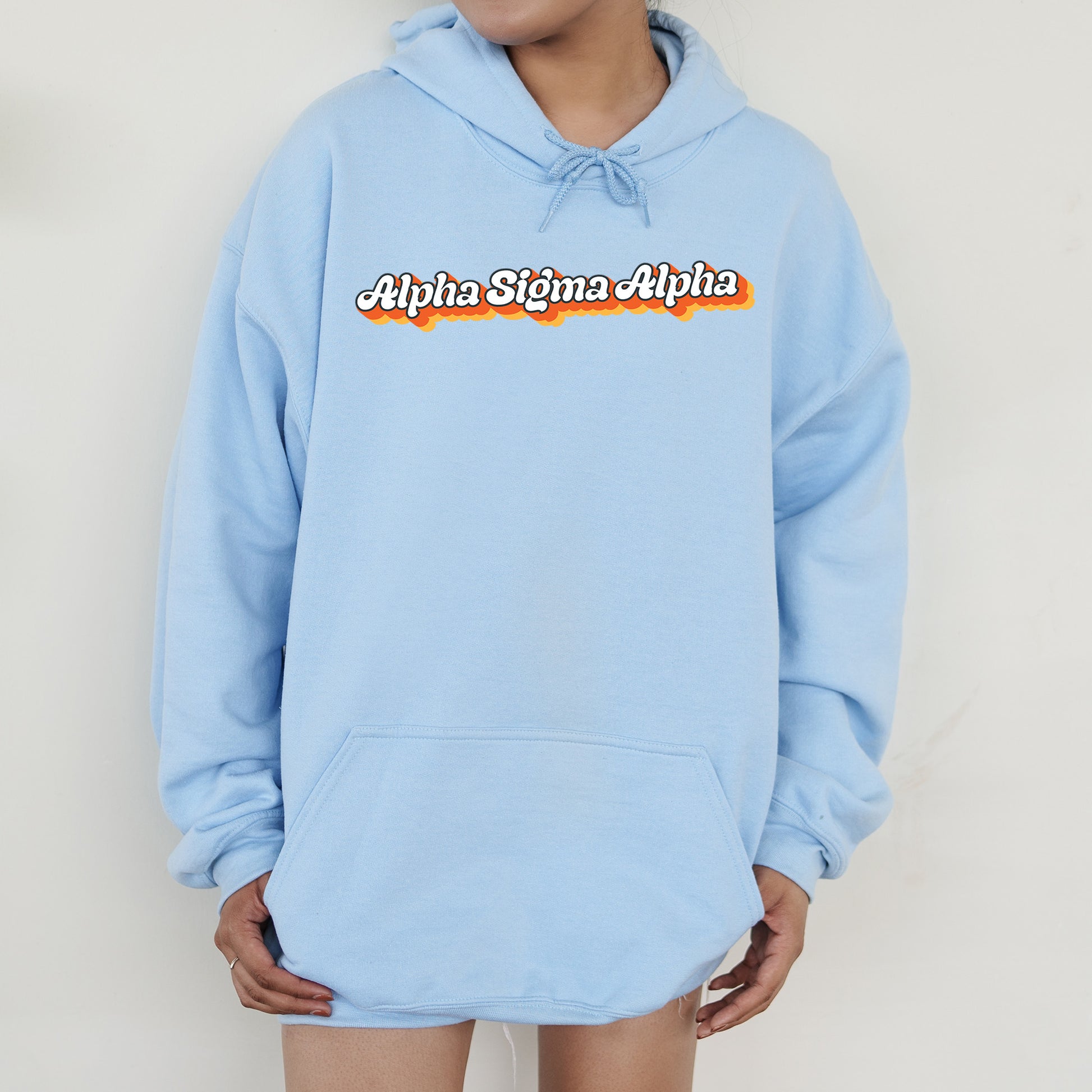 a person wearing a blue hoodie with the words aloha state aloh