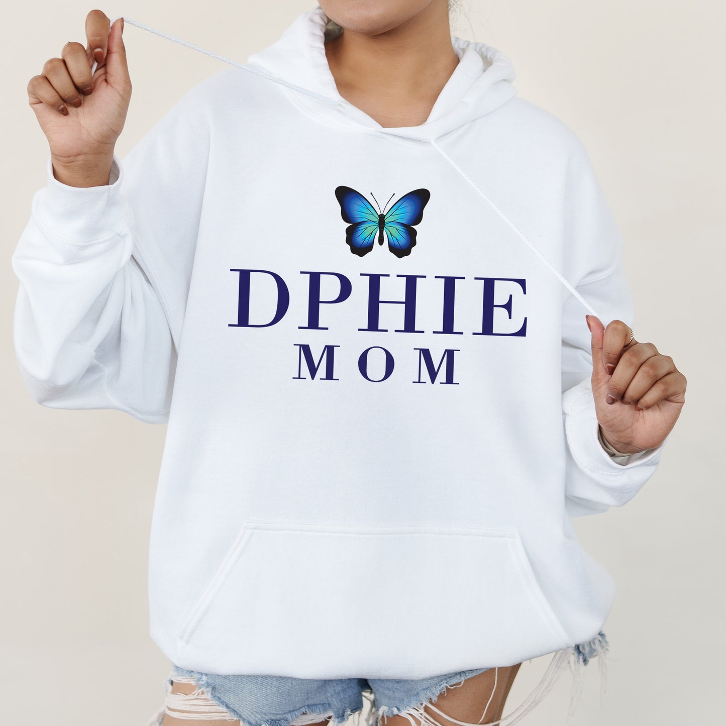 a woman wearing a white hoodie with a blue butterfly on it