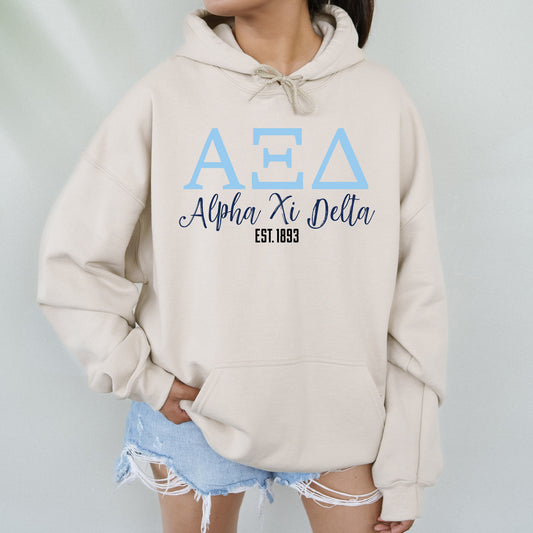 a woman wearing a hoodie with the letters aea on it