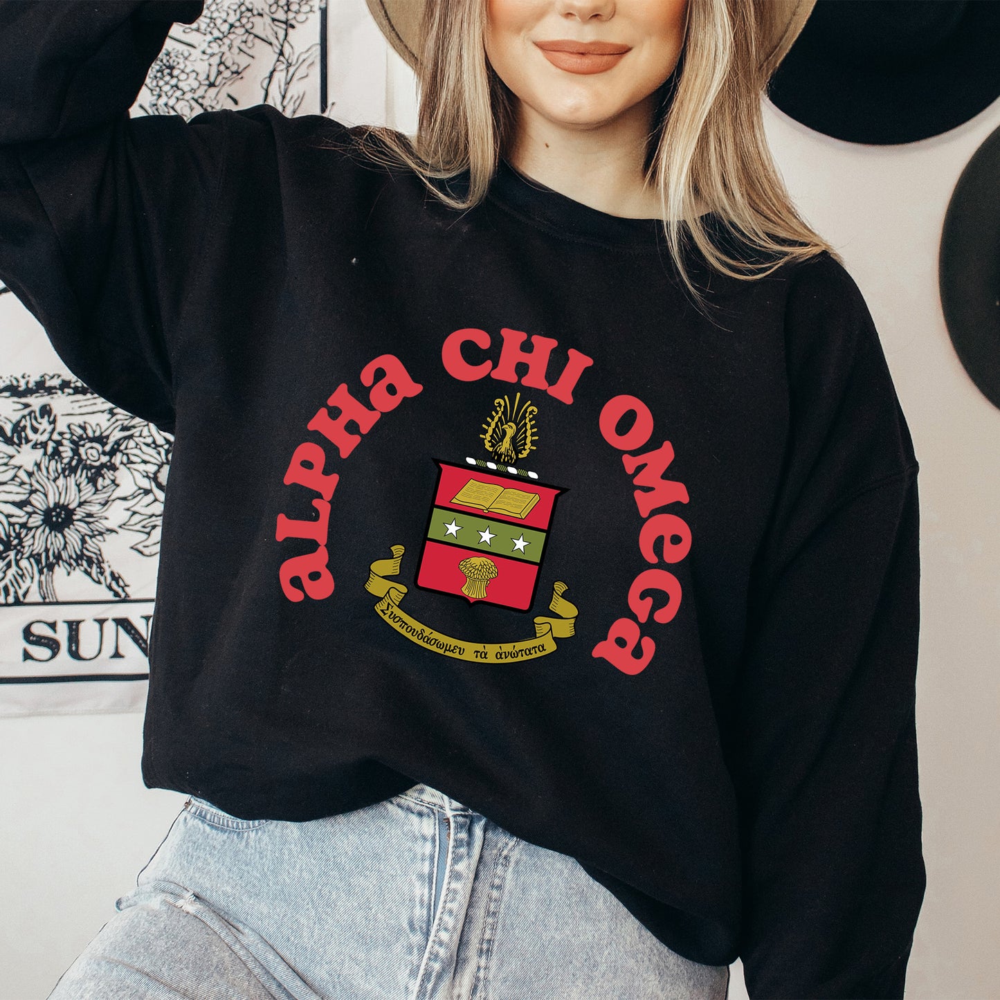 a woman wearing a hat and a black sweatshirt