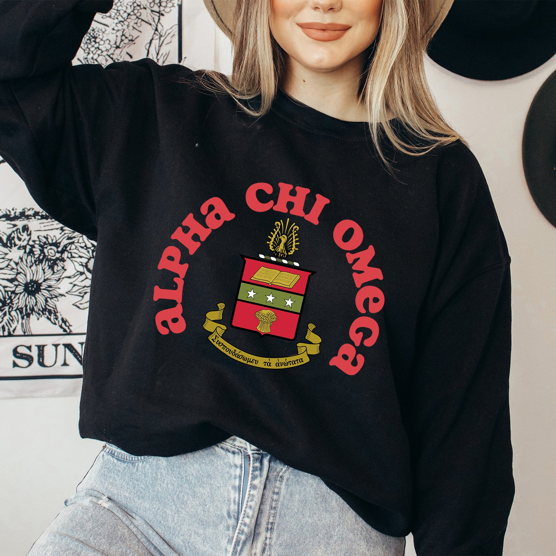 a woman wearing a hat and a black sweatshirt