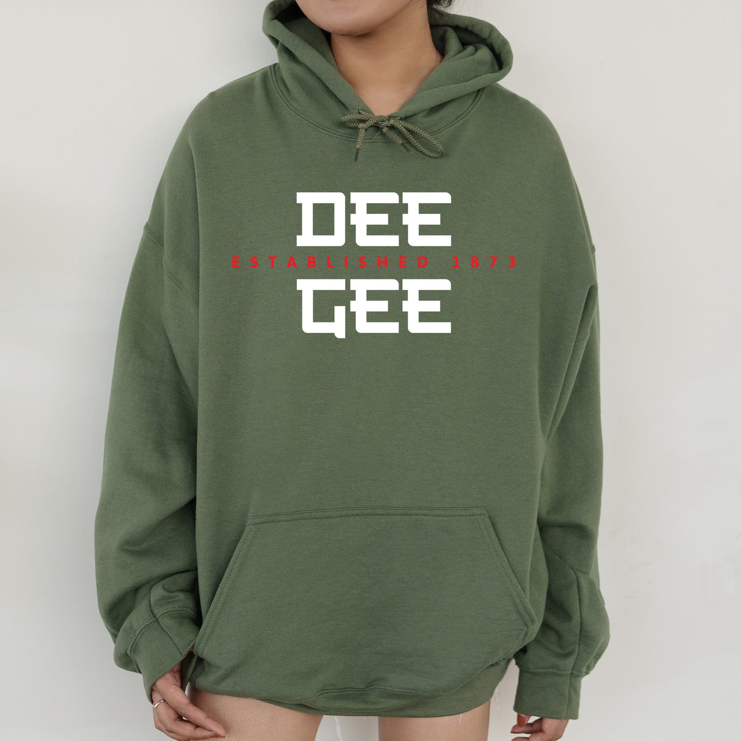 a person wearing a green hoodie that says dee gee