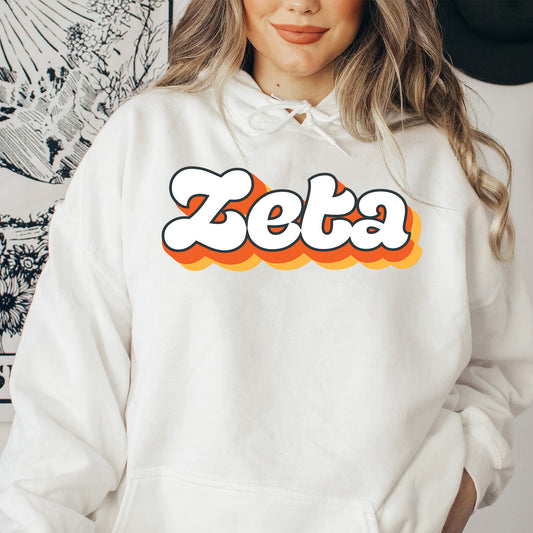 a woman wearing a white hoodie with the word zeba on it