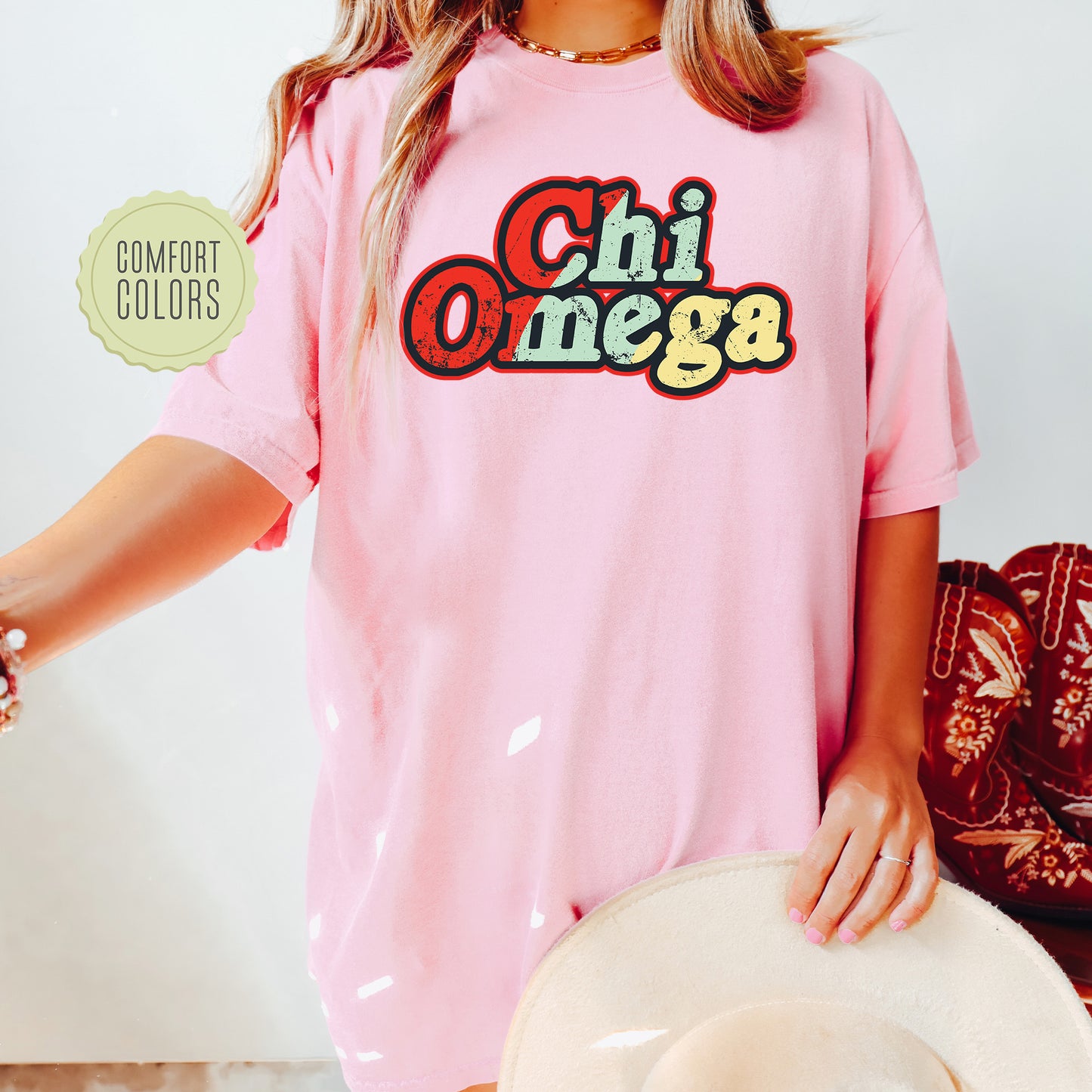 a woman wearing a pink shirt and hat