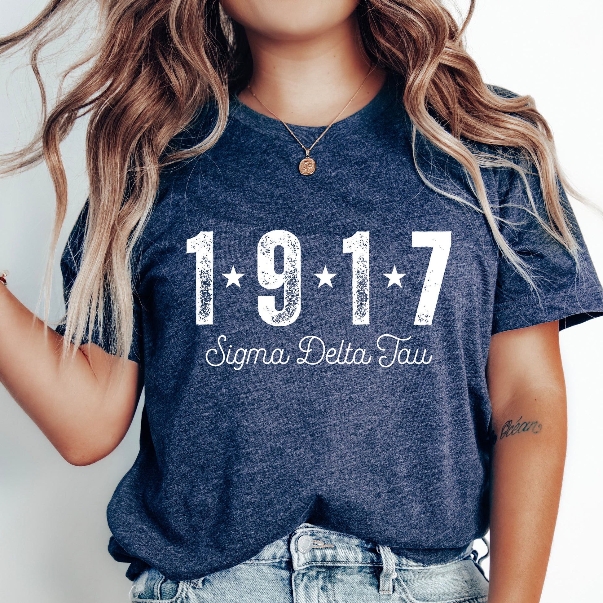a woman wearing a t - shirt with the number 1917 written on it