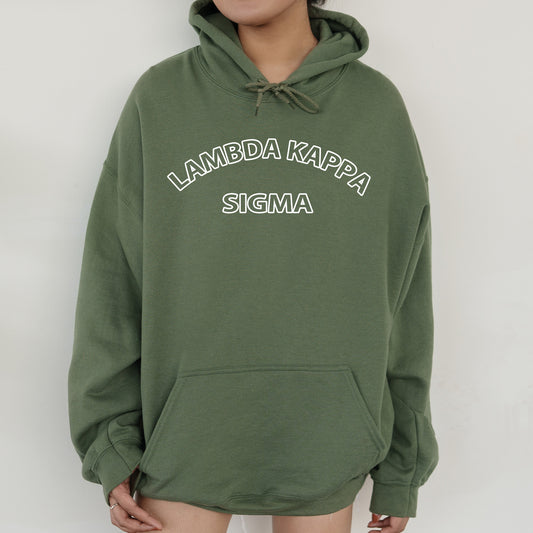 a woman wearing a green hoodie that says lambda kapa stigma