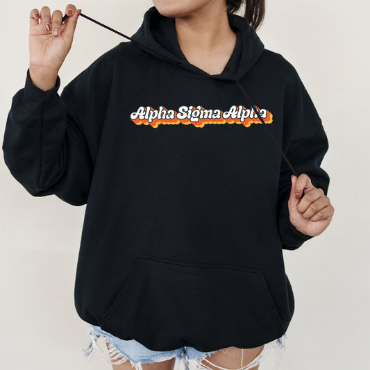 a woman in a black hoodie holding a cigarette