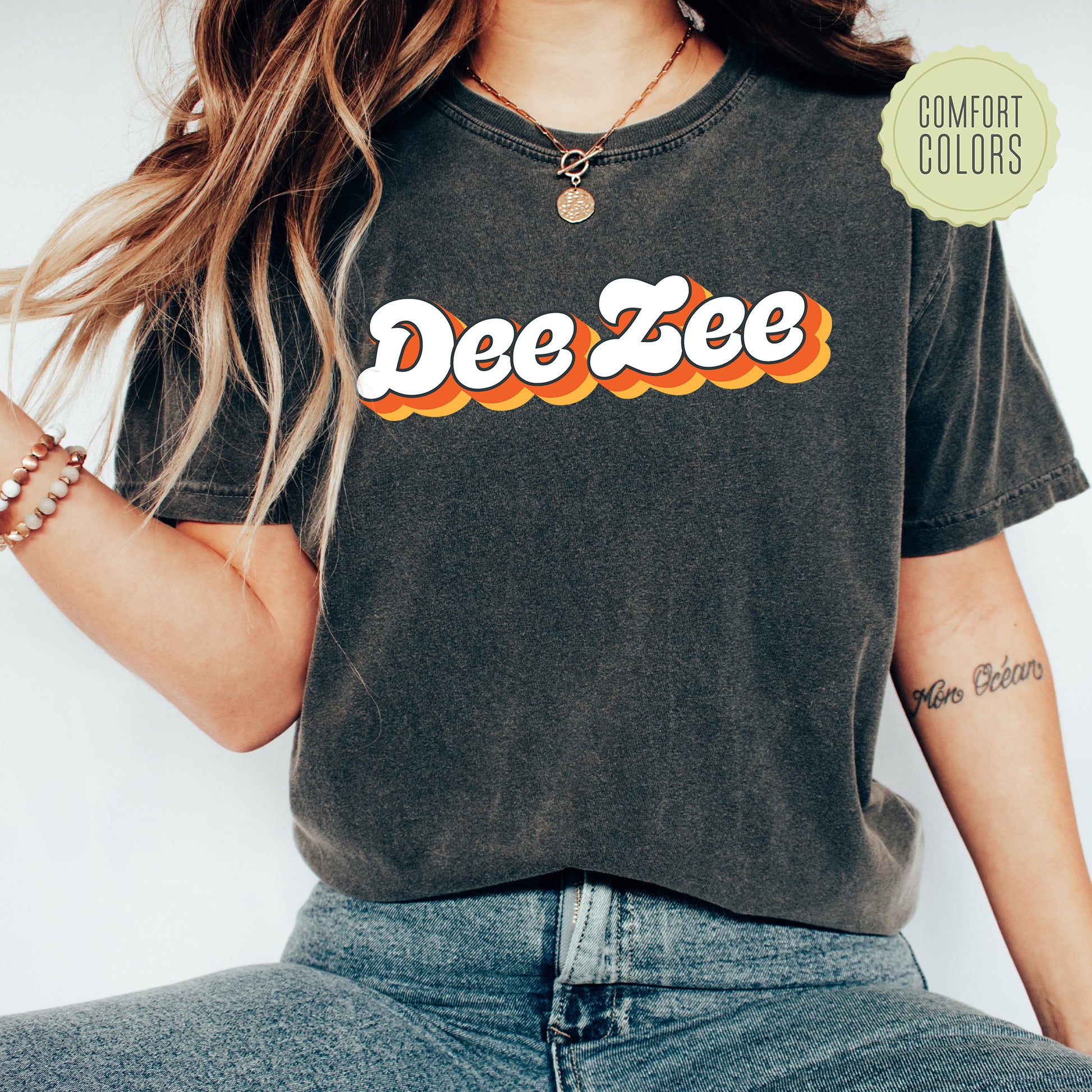 a woman wearing a tee shirt with the word dee zee on it