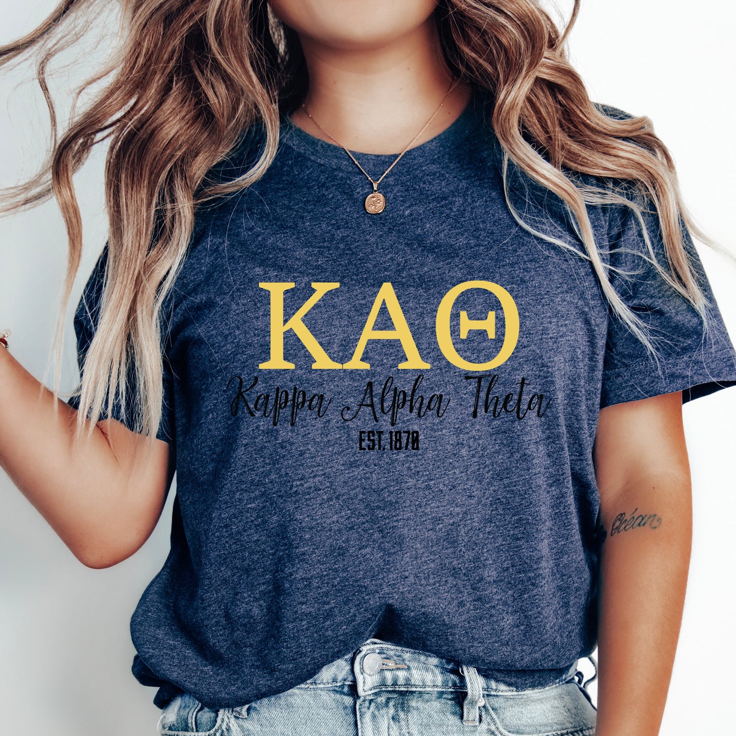 a woman with long hair wearing a kao shirt