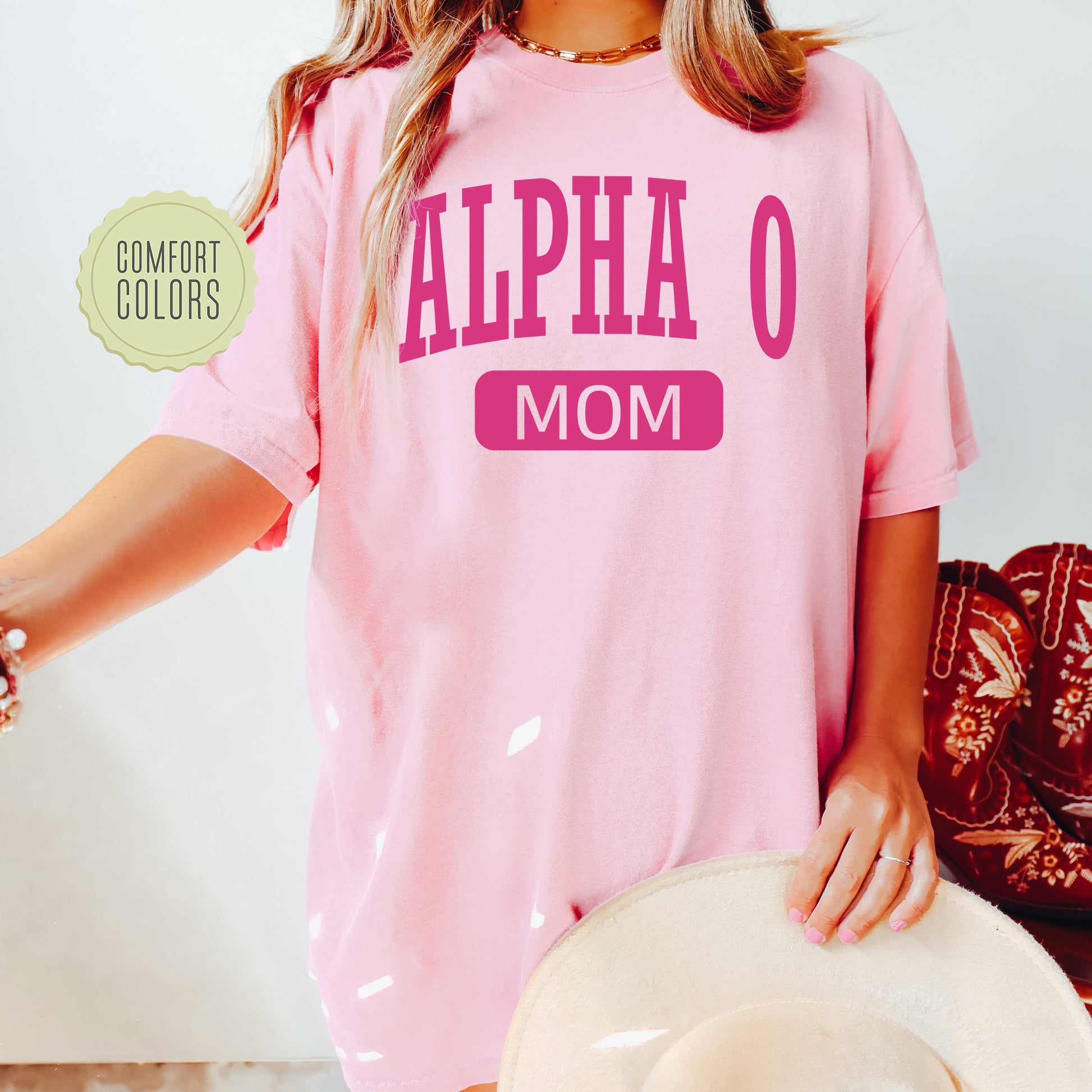 a woman wearing a pink shirt and hat