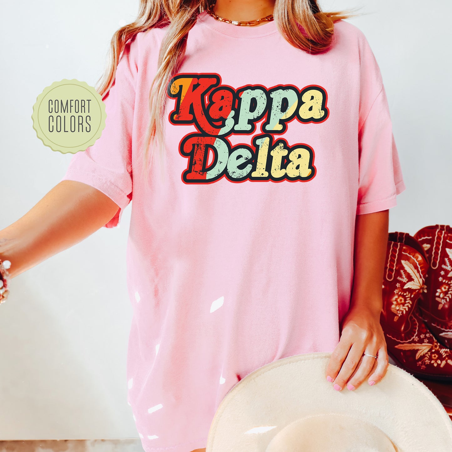 a woman wearing a pink shirt and hat