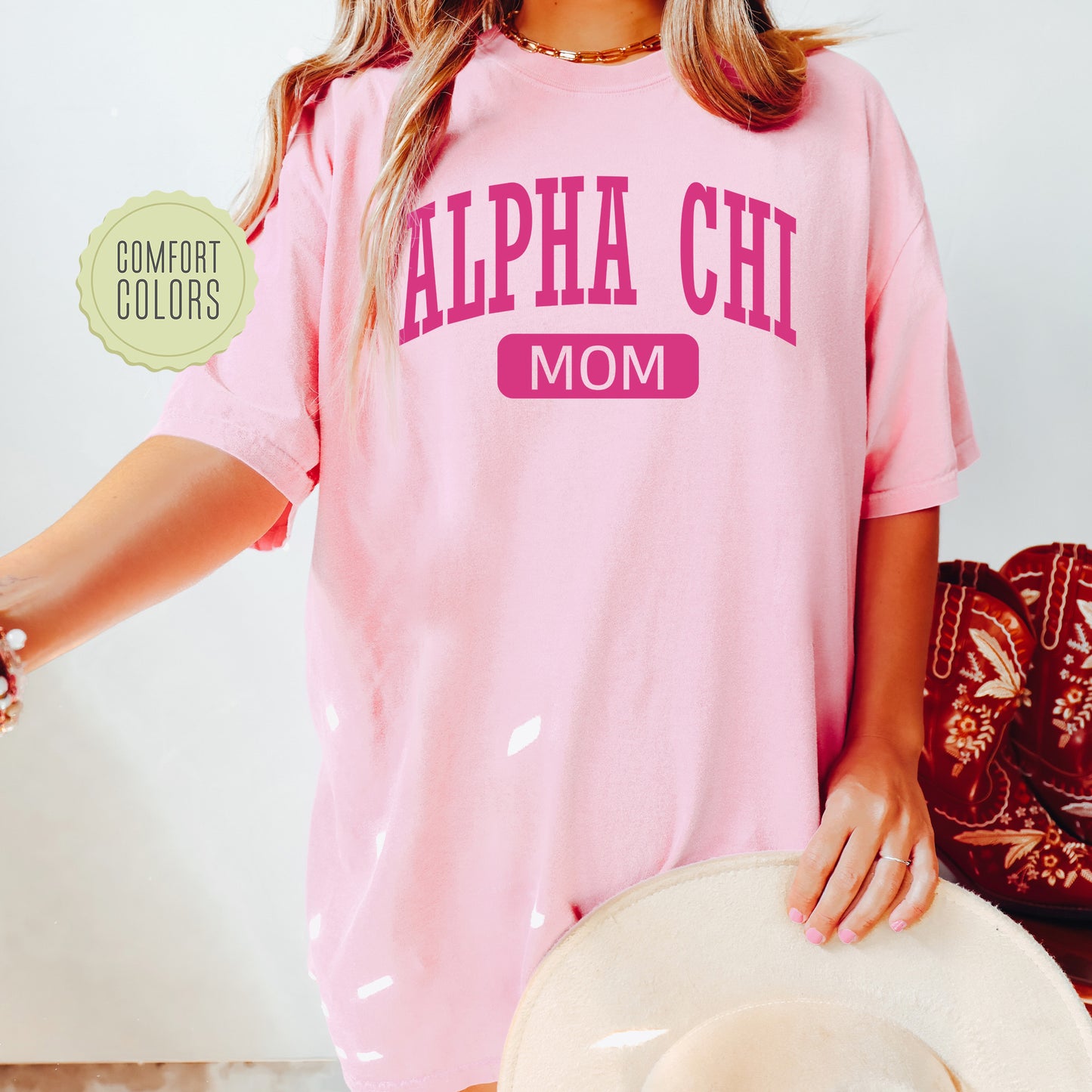 a woman wearing a pink shirt and hat