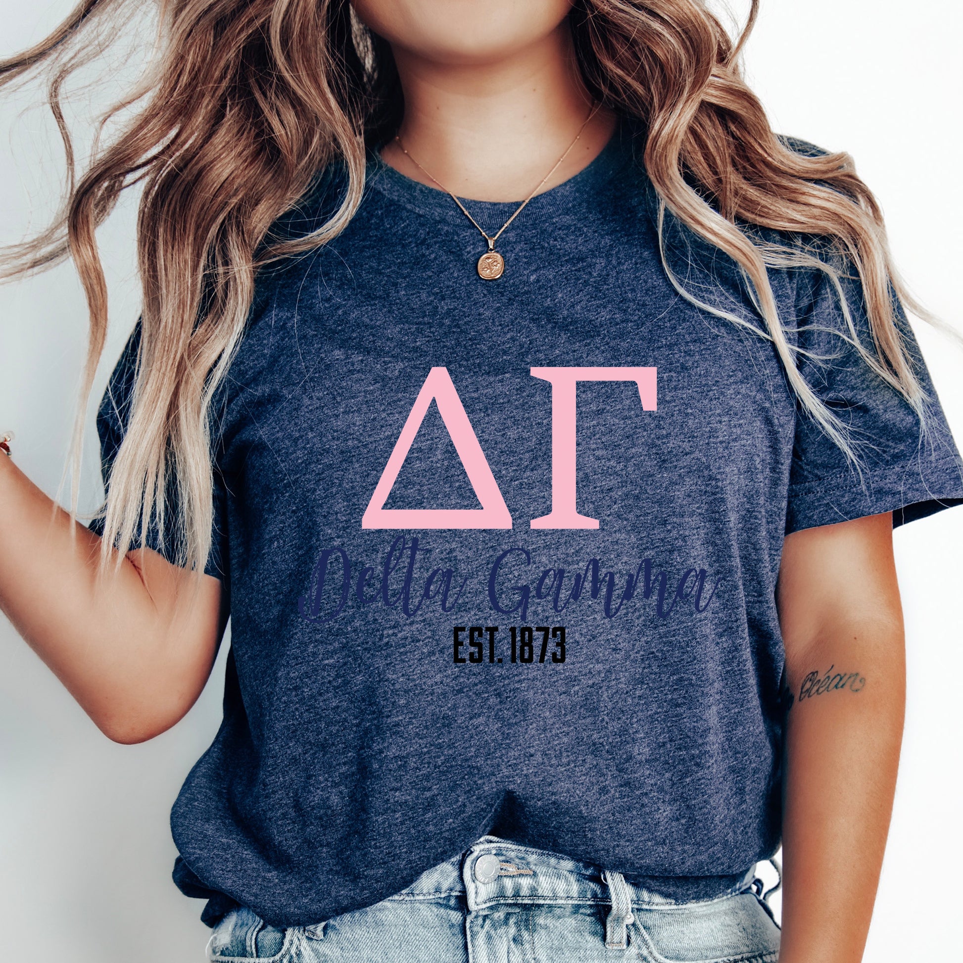 a woman with long hair wearing a delta t - shirt