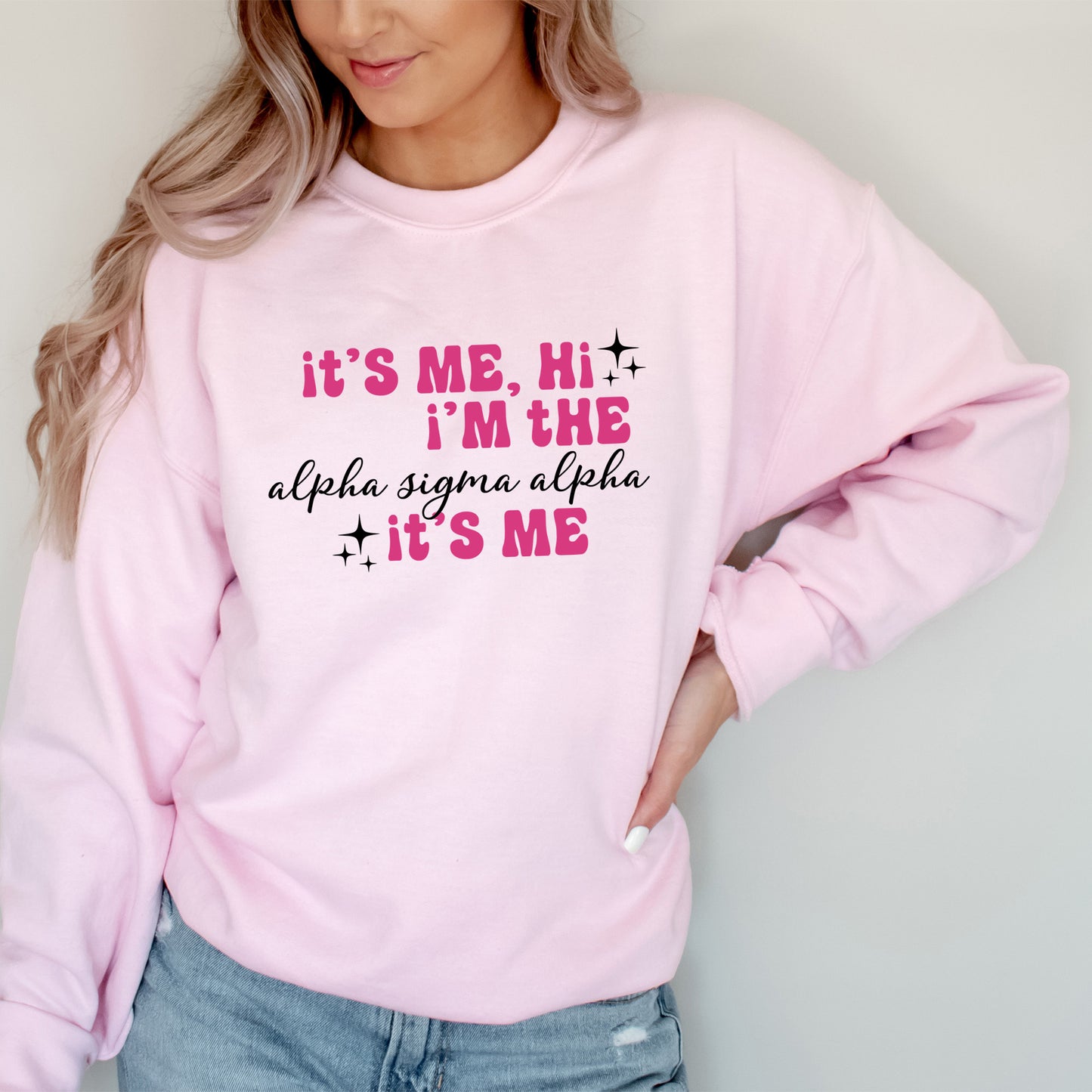 a woman wearing a pink sweatshirt that says it's me, i'm