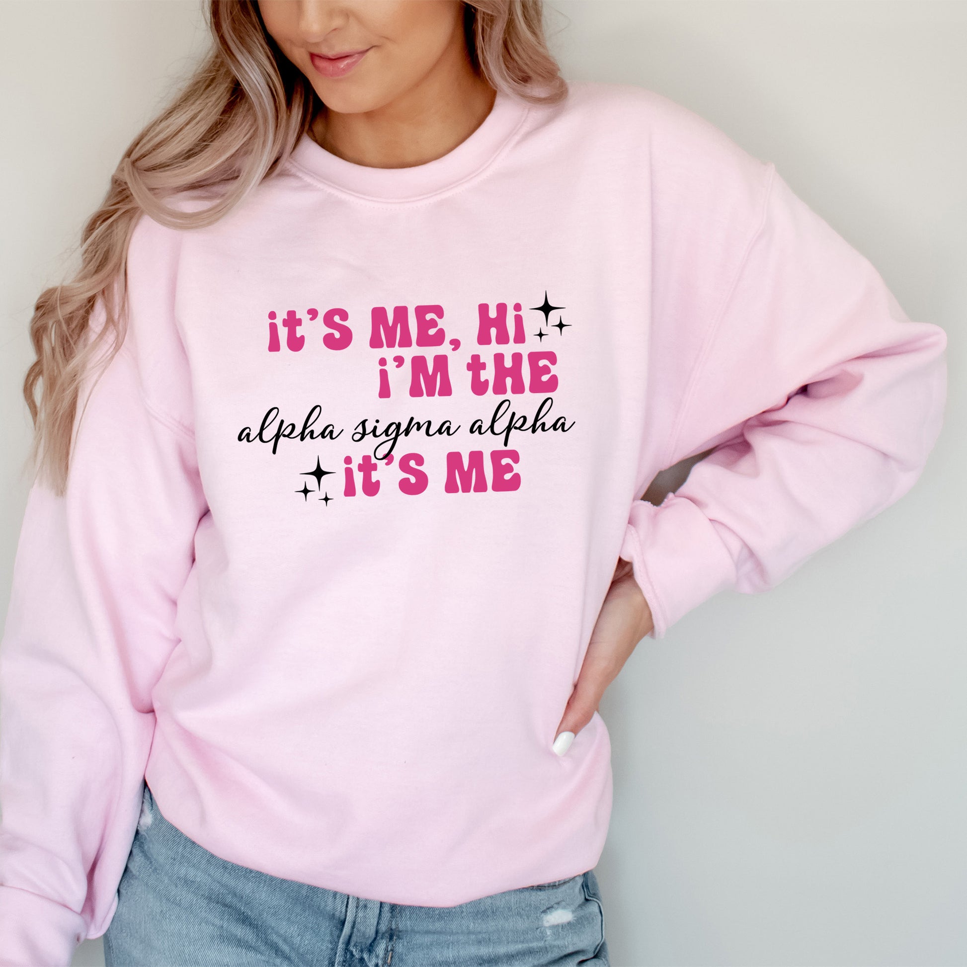 a woman wearing a pink sweatshirt that says it's me, i'm