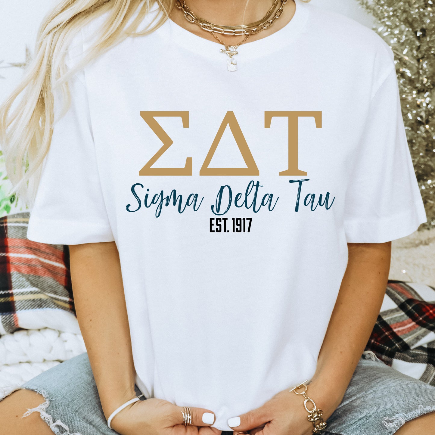 a woman wearing a white tshirt with the word zat on it