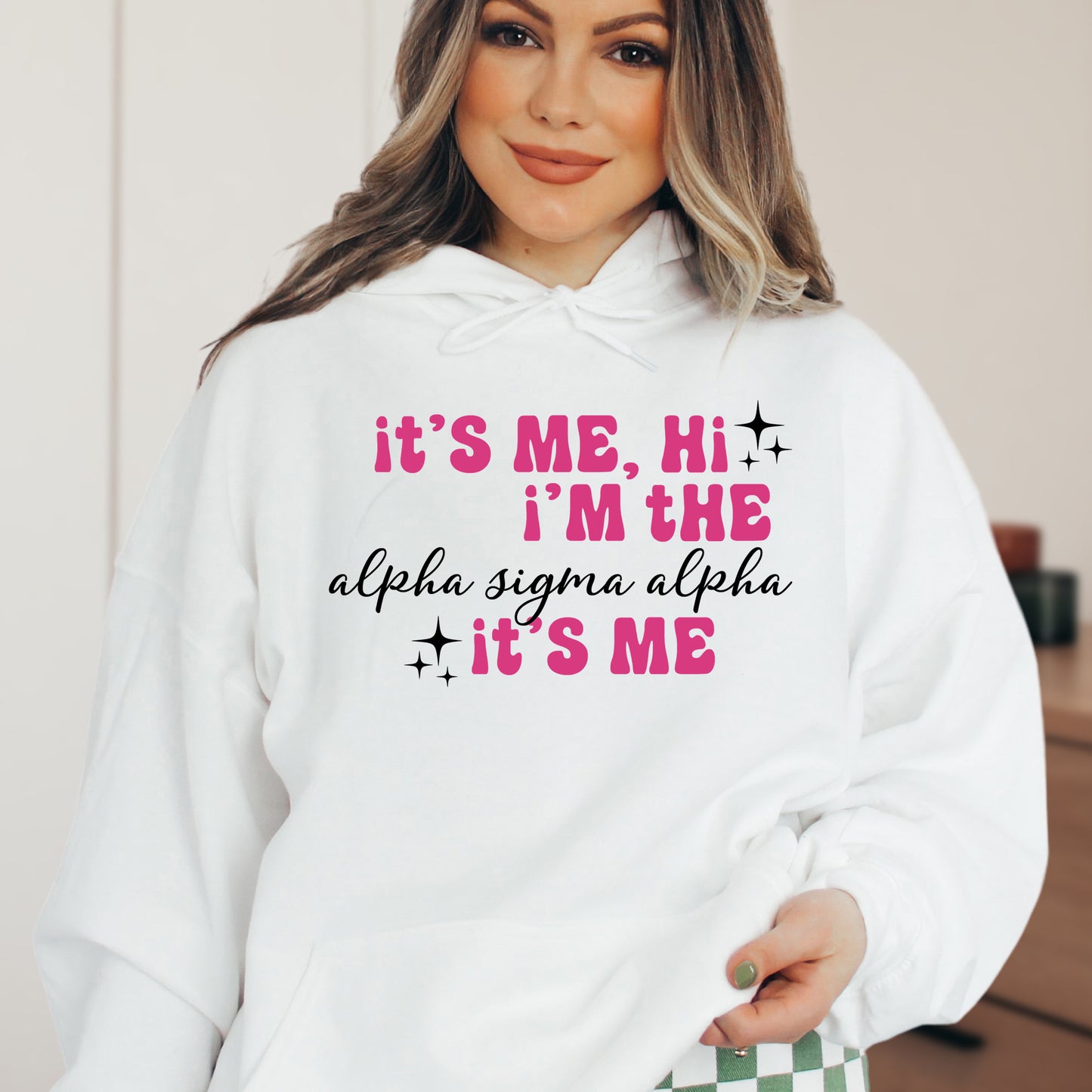a woman wearing a white hoodie that says it's me, i '