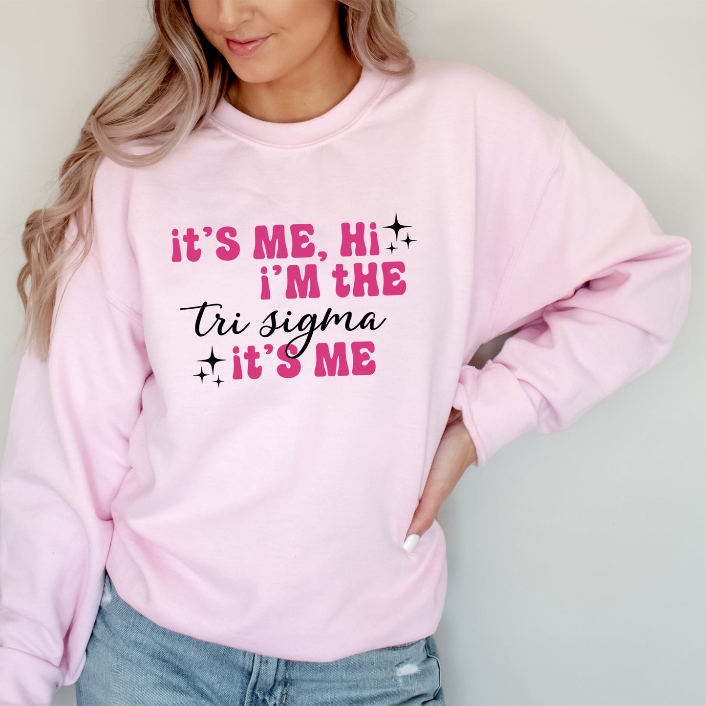 a woman wearing a pink sweatshirt that says it's me, i'm