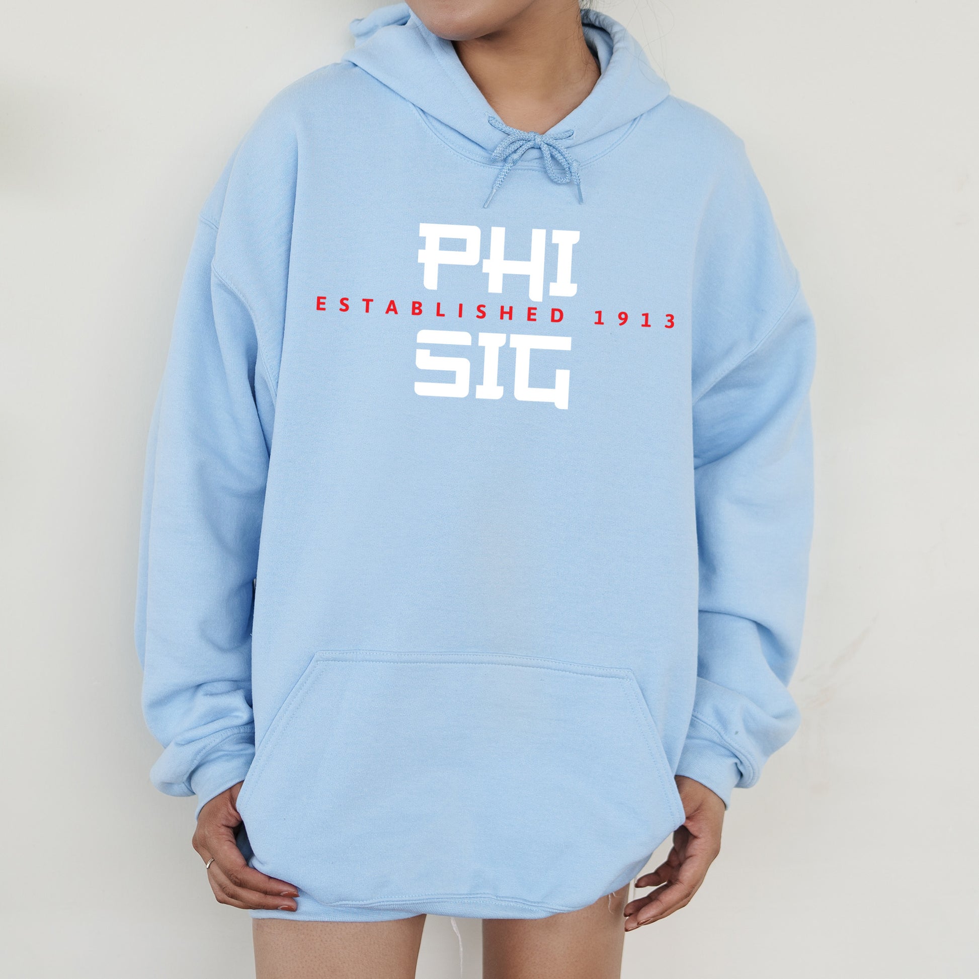 a person wearing a blue hoodie that says phi est est est est est est