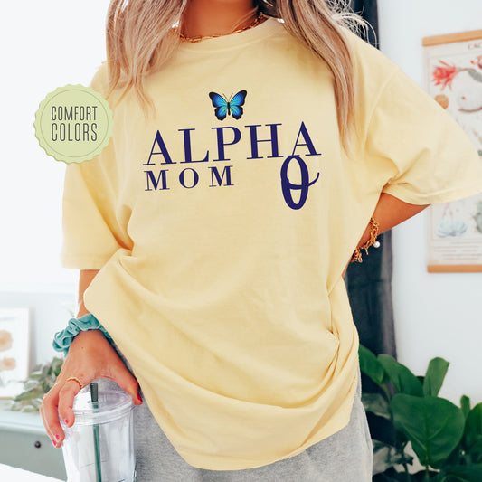 a woman wearing a yellow shirt with a butterfly on it