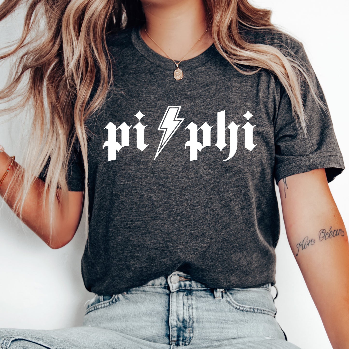 a woman wearing a black shirt with a lightning bolt on it
