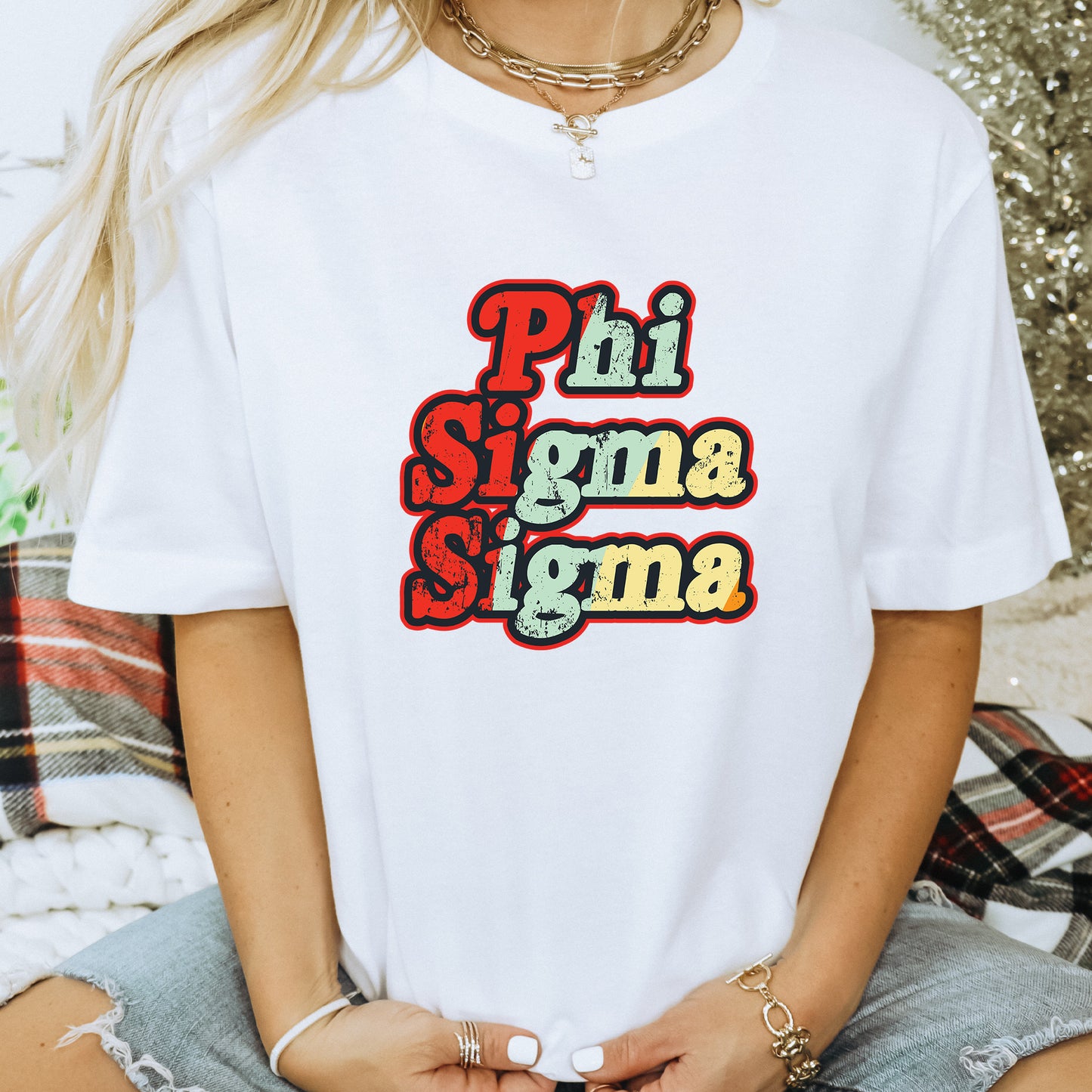 a woman wearing a white phi sigmama t - shirt