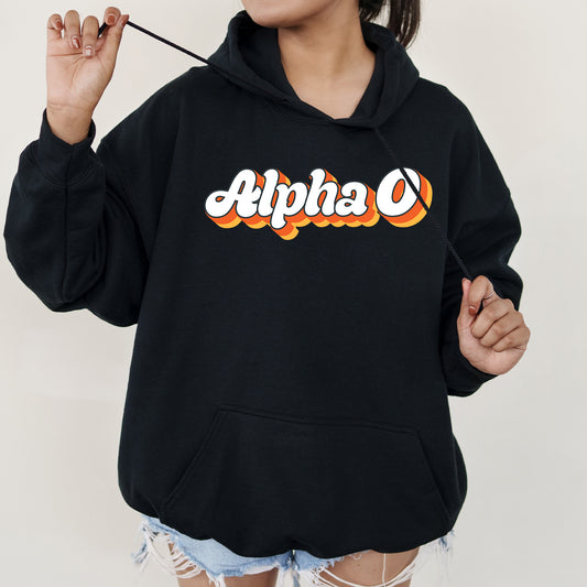 a woman wearing a black hoodie with the word alpha on it
