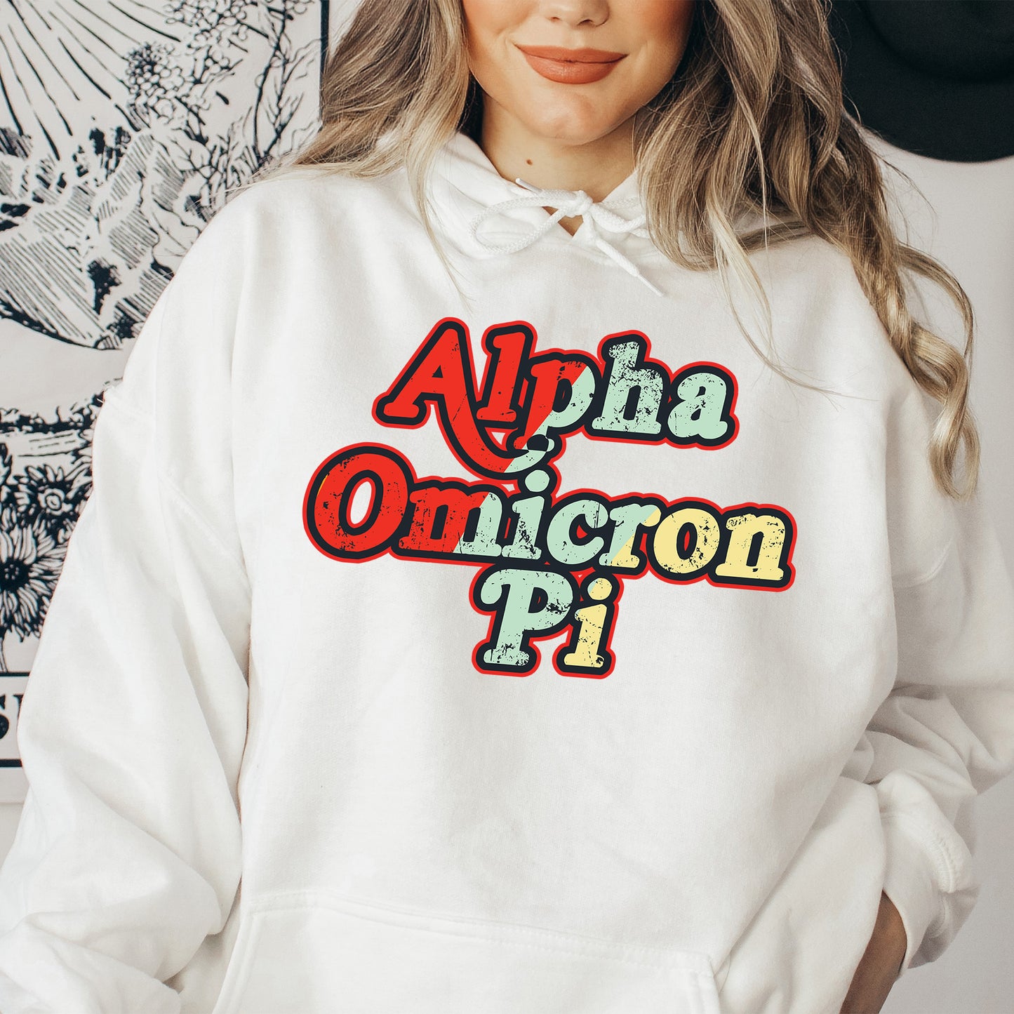 a woman wearing a white hoodie with the words ahha omicoron pi