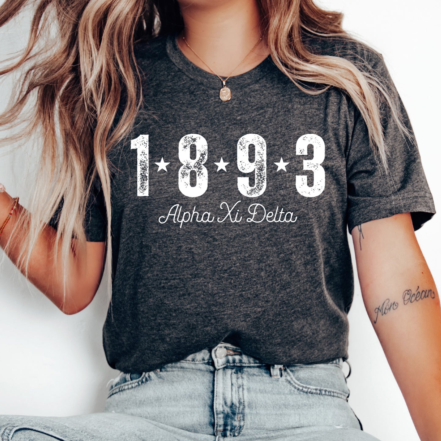 a woman wearing a t - shirt with the year 1932 printed on it