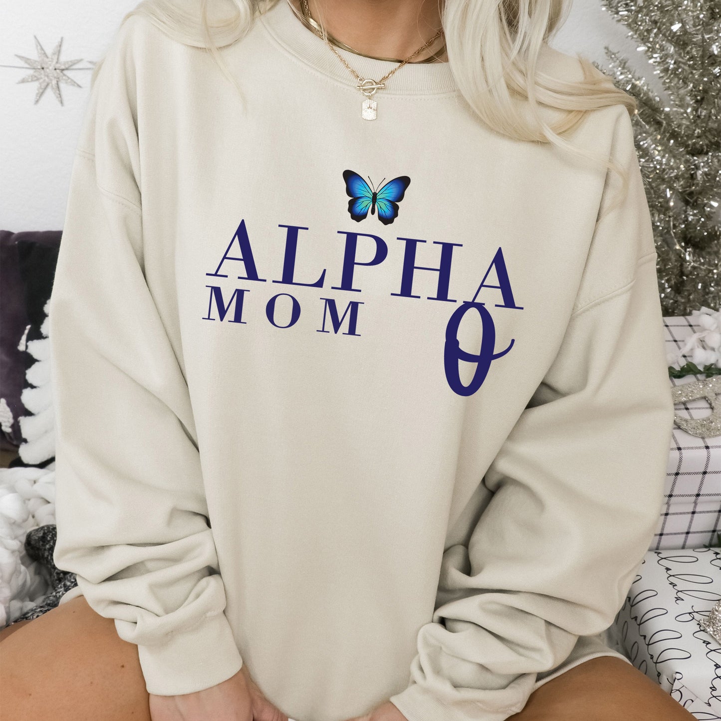 a woman wearing a sweatshirt with a butterfly on it