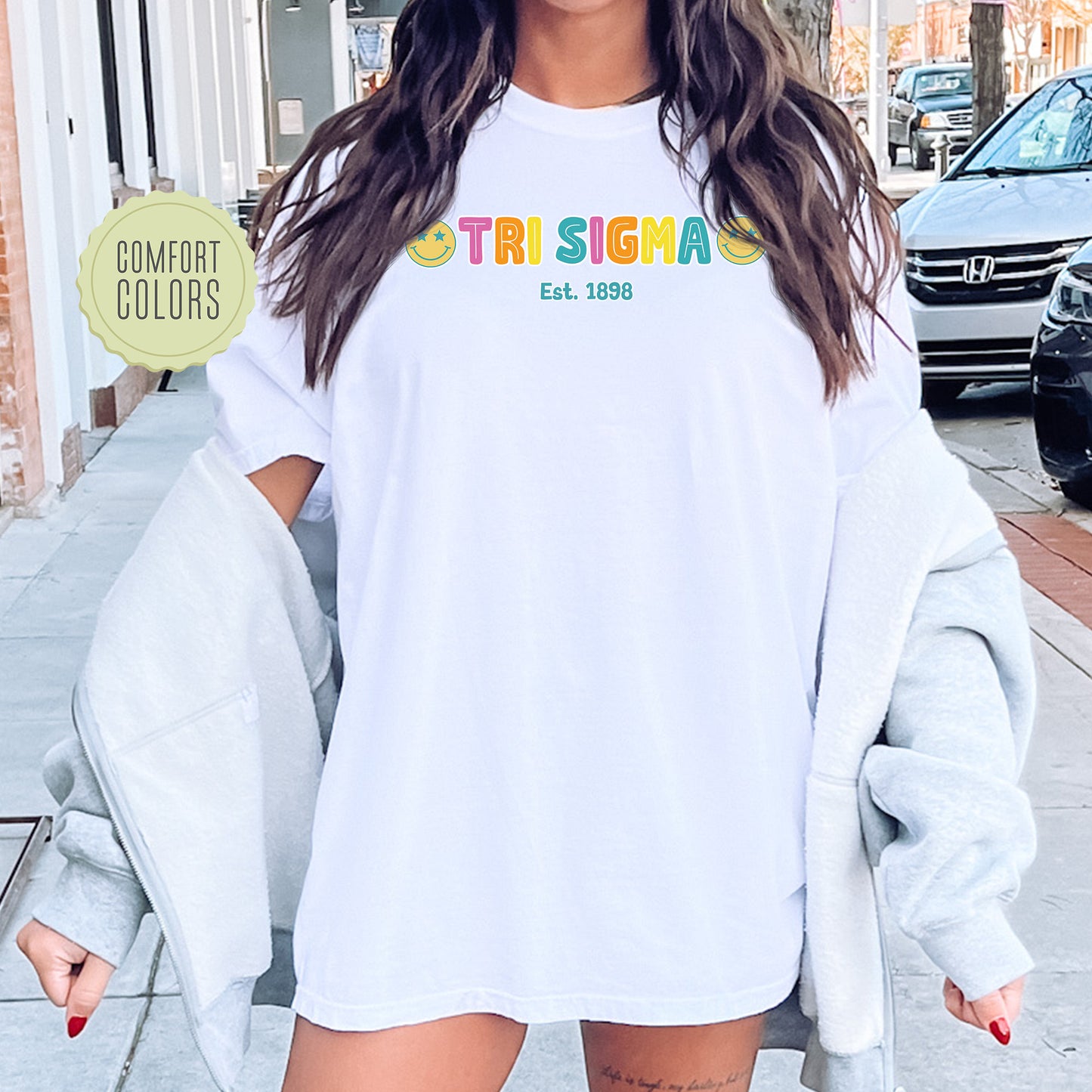 a woman wearing a white shirt and shorts