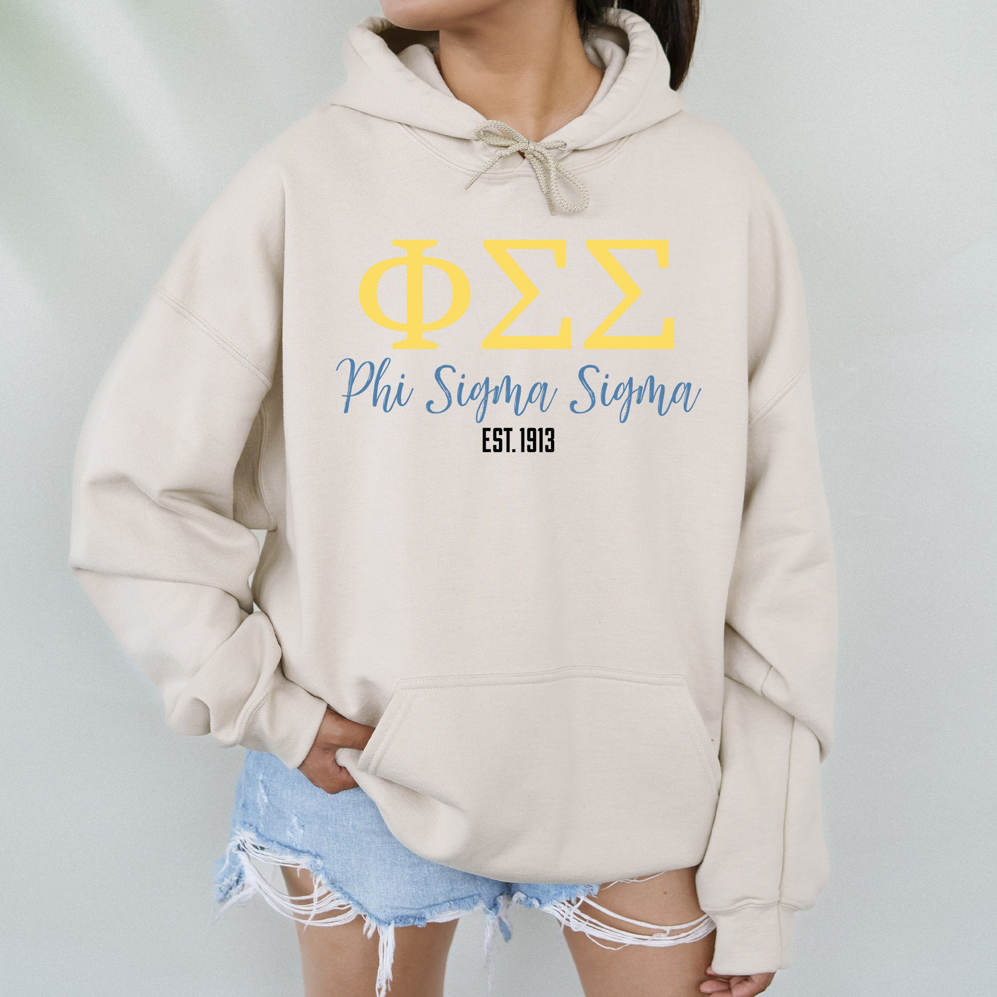 a woman wearing a hoodie with a phi symbol on it