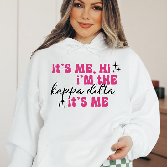 a woman wearing a white hoodie that says it's me, i '