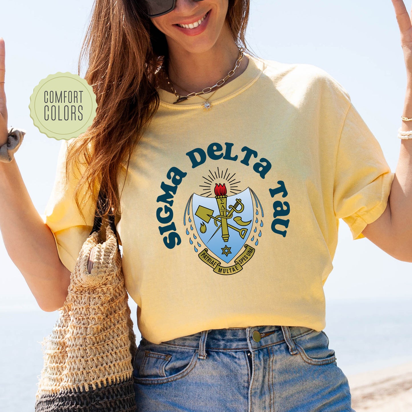 a woman in a yellow shirt is holding a bag