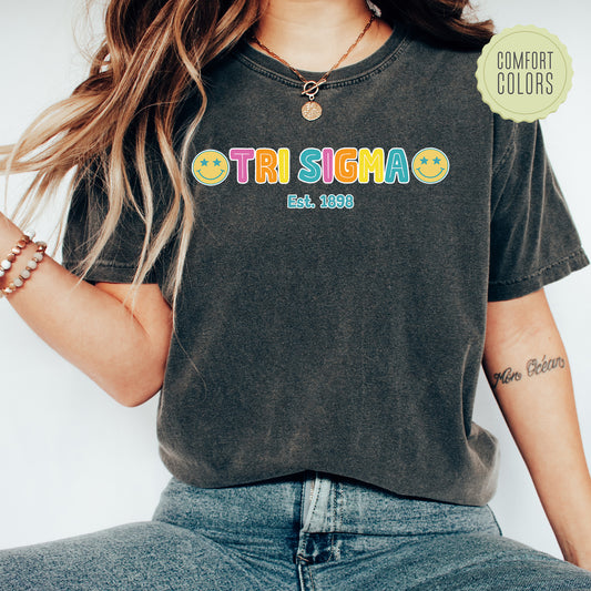 a woman wearing a black tshirt with the word trisima on it