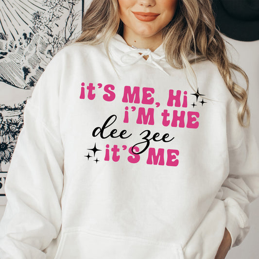 a woman wearing a white hoodie that says it's me, i '